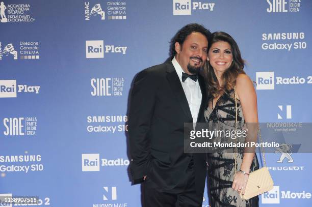 Italian actor, comedian, showman and director Enrico Brignano and Flora Canto during the red carpet of the 64th edition of the David di Donatello....