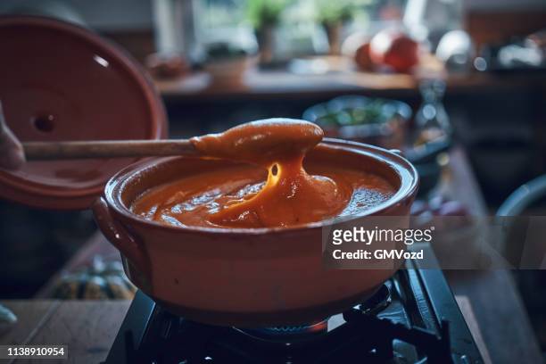 preparing pumpkin soup in domestic kitchen - pumpkin soup stock pictures, royalty-free photos & images