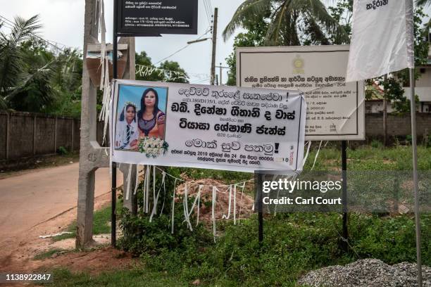 Banner announcing a wake for 12 year old Jiyasha Sheshani Janz and her mother Dineesha Geethani de Vaas, is displayed near their family home after...