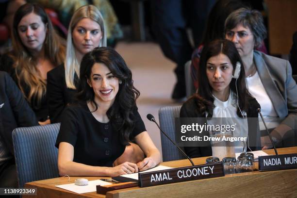 Human rights lawyer Amal Clooney as Iraqi human rights activist Nadia Murad Basee Taha looks on during a United Nations Security Council meeting at...