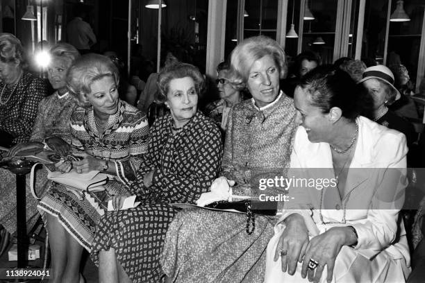 Picture taken on July 26, 1977 at Paris showing Eve Barre , Jacqueline Auriol , Claude Pompidou and Alice Saunier-Seite attending the fashion show...