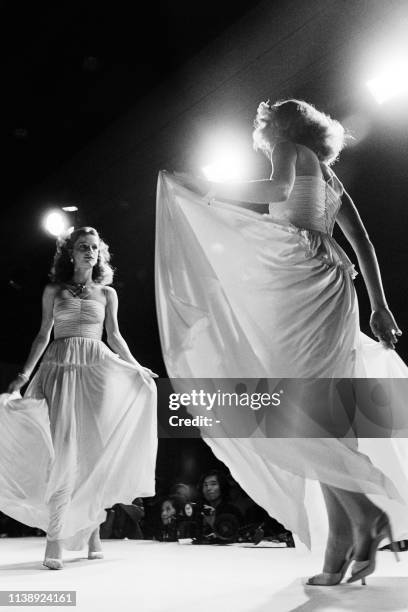 Picture taken on October 24, 1977 at Paris showing fashion models wearing clothings made by Chanel for its ready-to-wear Spring-Summer 1978...