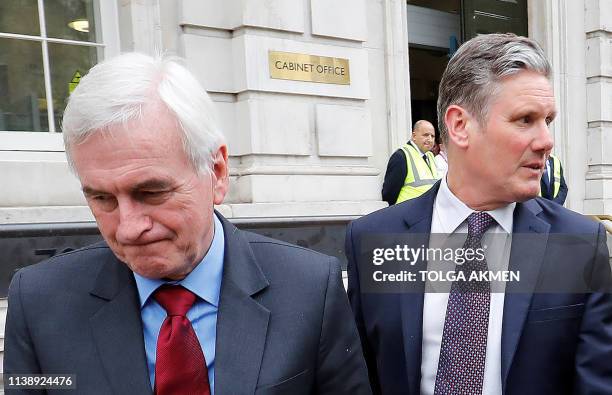 Labour's Shadow chancellor John McDonnell and Labour's Brexit spokesman Keir Starmer react as they leave the Cabinet office after attending a Brexit...