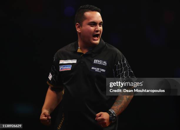 Jeffrey de Zwaan of the Netherlands celebrates as he competes against Rob Cross of England during day two of the 2019 Unibet Premier League Darts on...