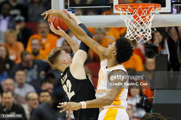 Kyle Alexander of the Tennessee Volunteers blocks a shot by Matt Haarms of the Purdue Boilermakers during the first half of the 2019 NCAA Men's...