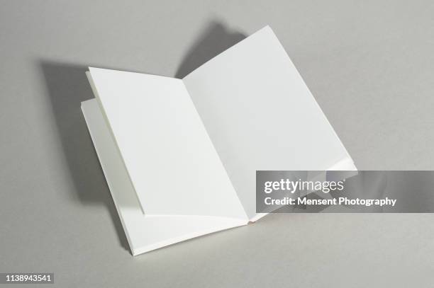 opened blank magazine book on gray background - prospekt stock-fotos und bilder