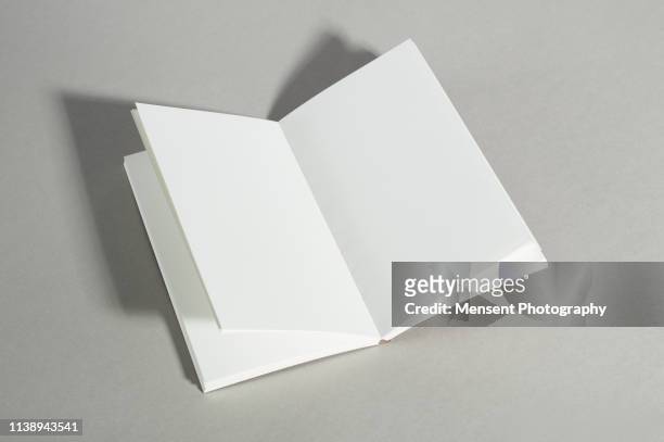 opened blank magazine book on gray background - notepad table stock pictures, royalty-free photos & images