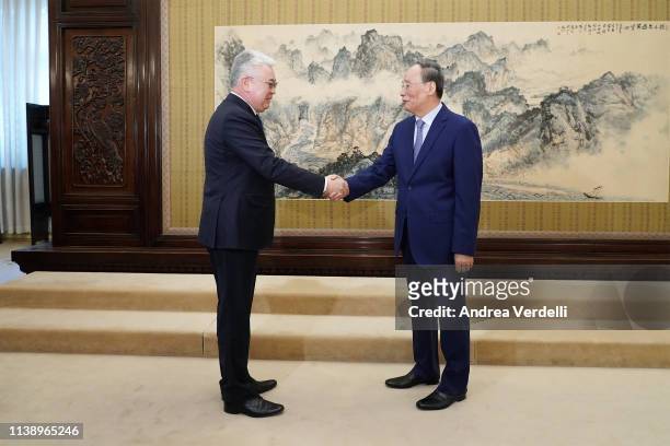 Chinese Vice President Wang Qishan and Kazakh Foreign Minister Beibut Atamkulov shake hands at Zhongnanhai on March 29, 2019 in Beijing, China.