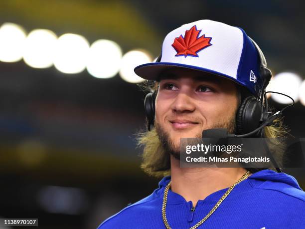 Bo Bichette of the Toronto Blue Jays is interviewed prior to MLB spring training game against the Milwaukee Brewers at Olympic Stadium on March 26,...