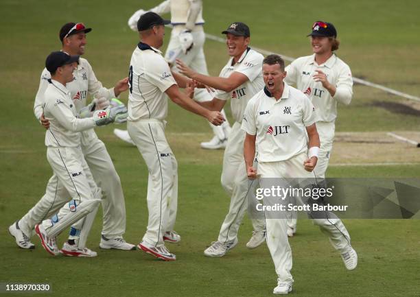 Peter Siddle of Victoria celebrates after dismissing Trent Copeland of New South Wales during day two of the Sheffield Shield Final match between...