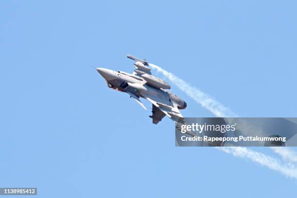 military fighter jet on blue sky - air defense stock pictures, royalty-free photos & images