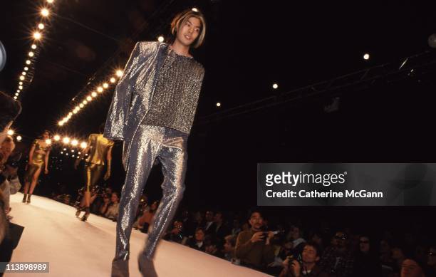 James Iha of Smashing Pumpkins models Anna Sui fashions during a fashion show in 1994 in New York City, New York.