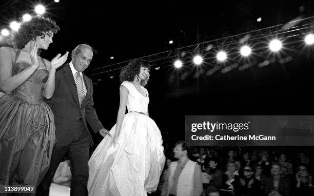 Oscar De La Renta and models on runway after a fashion show in the mid 1990s in New York City, New York.