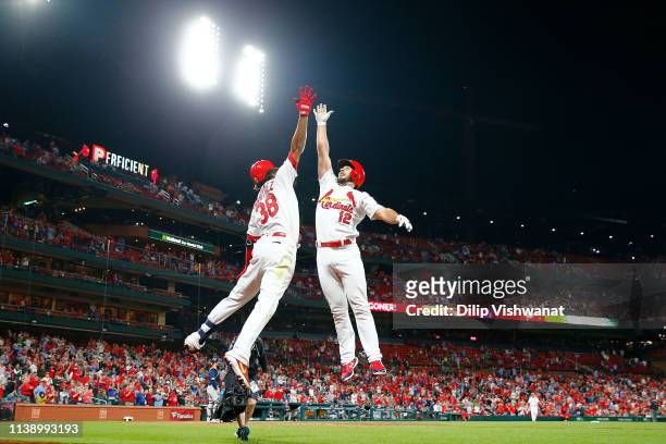 Jose Martinez of the St. Louis Cardinals congratulates Paul DeJong of the St. Louis Cardinals after DeJong hits a home run against the Milwaukee...