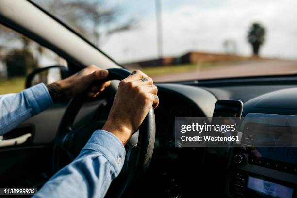 hands of businessman driving car - hands steering wheel stock pictures, royalty-free photos & images