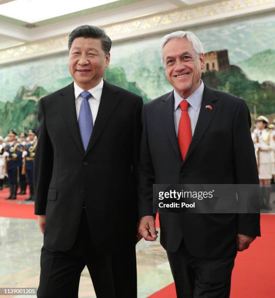 Chile's President Sebastian Pinera, right, and Chinese President Xi Jinping, left, attend the welcome ceremony at the Great Hall of People in...