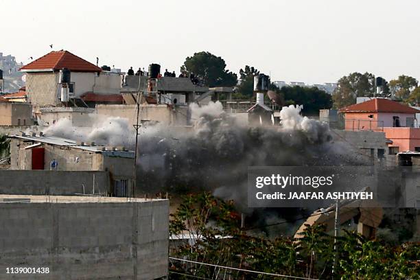 Israeli forces blow up the family house of Palestinian assailant Omar Abu Laila, in Az-Zawiya village, in the Israeli-occupied West Bank, April 24,...