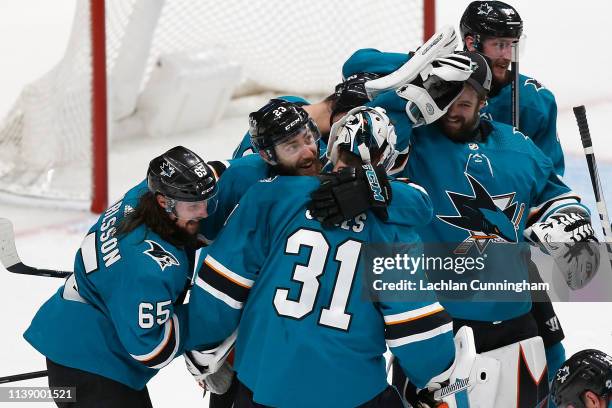 San Jose Sharks goalie Martin Jones celebrates with teammates after an overtime win against the Vegas Golden Knights in Game Seven of the Western...