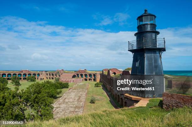 usa, florida, florida keys, dry tortugas national park, lighthouse in fort jefferson - citadel v florida stock pictures, royalty-free photos & images