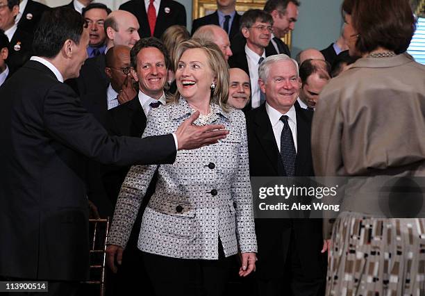 Chinese Vice Premier Wang Qishan shares a moment with U.S. Secretary Hillary Clinton as Secretary of the Treasury Timothy Geithner , Federal Reserve...