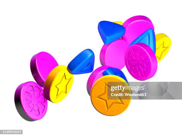 stockillustraties, clipart, cartoons en iconen met colourful ecstasy pills on white ground, 3d rendering - xtc