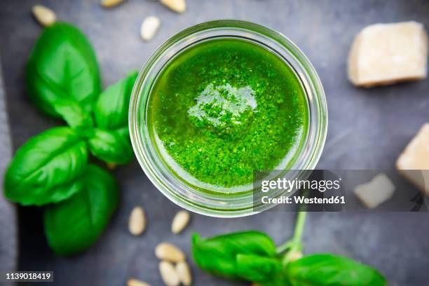 glass of homemade pesto genovese, close-up - pesto sauce stock pictures, royalty-free photos & images