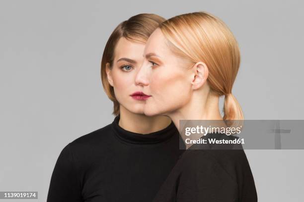 studio portrait of mother and adult daughter - mature woman daughter stock pictures, royalty-free photos & images