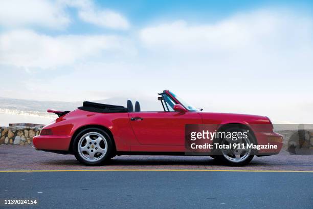 Porsche 964 Carrera 2 Cabriolet sports car photographed on a mountain road near Cape Town in South Africa, on January 30, 2018.