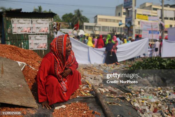 Relative of a victim of the Rana Plaza building collapse reacts as she marks sixth anniversary of the garment factory disaster at the site where the...