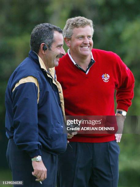 European player Colin Montgomerie with his team Captain Sam Torrance during his fourball game with Bernhard Langer against Phil Mickelson and David...