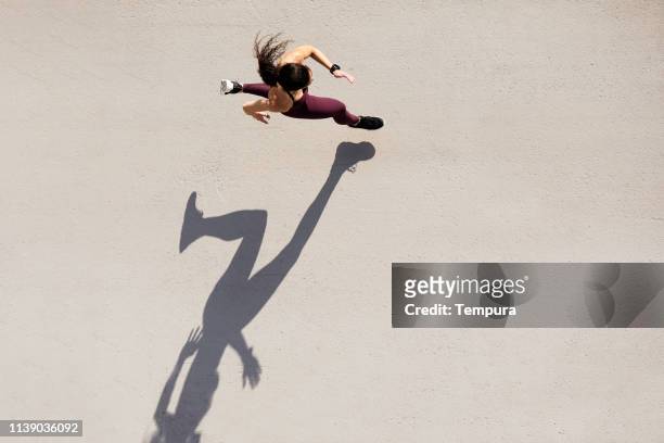sprinter seen from above with shadow and copy space. - women working out stock pictures, royalty-free photos & images