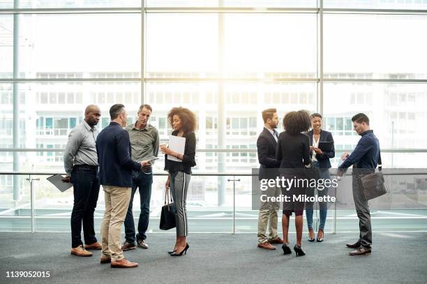 networking with fellow attendees - attending conference stock pictures, royalty-free photos & images