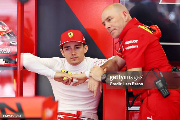 Charles Leclerc of Monaco and Ferrari talks with Jock Clear, Head of Engineering, Scuderia Ferrari in the garage during practice for the F1 Grand...