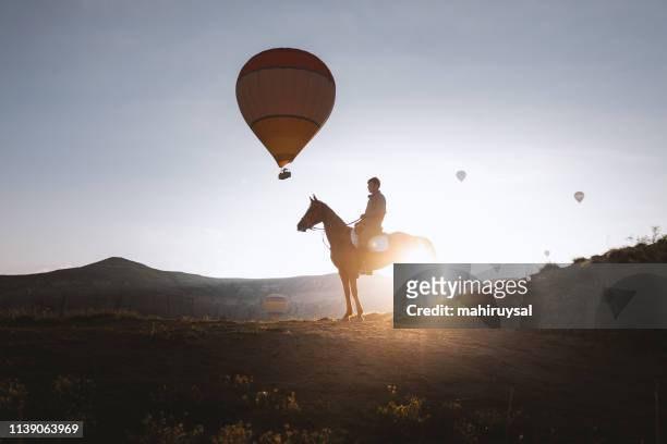 horseback rider - cappadocia hot air balloon stock pictures, royalty-free photos & images