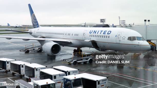 An United Airlines plane is parked at the gate on April 23 at Boston Logan International Airport.