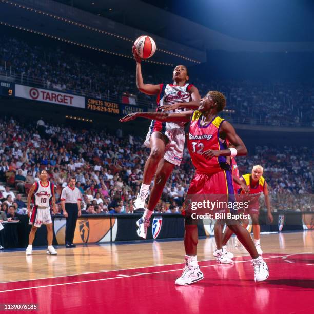 Cynthia Cooper of the Houston Comets goes to the basket against the Phoenix Mercury on June 24, 1997 at the Compaq Center in Houston, Texas. NOTE TO...
