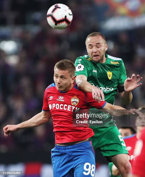 Ivan Oblyakov of PFC CSKA Moscow and Vladislav Kulik of FC Anji Makhachkala vie for the ball during the Russian Football League match between PFC...