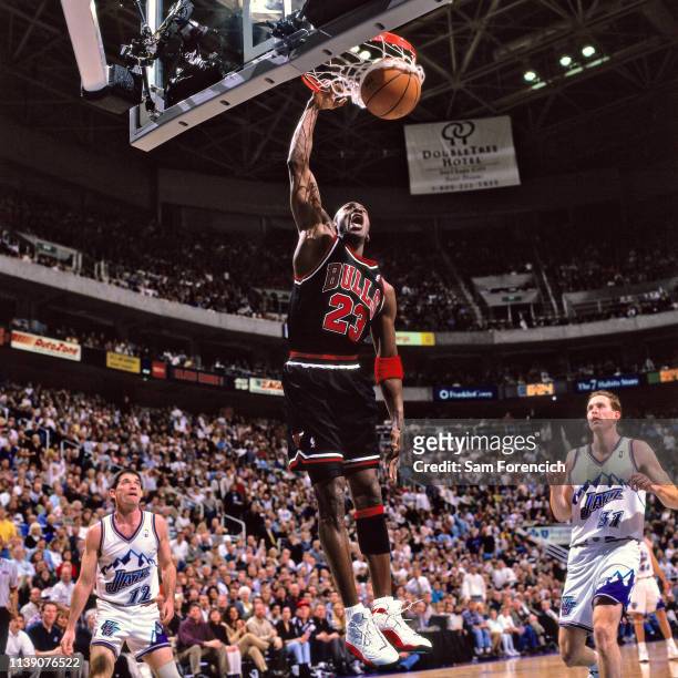 Michael Jordan of the Chicago Bulls dunks the ball against the Utah Jazz on February 4, 1998 at the Delta Center in Salt Lake City, Utah. NOTE TO...