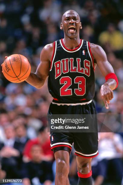 Michael Jordan of the Chicago Bulls handles the ball against the Dallas Mavericks on March 12, 1998 at the Reunion Arena in Dallas, Texas. NOTE TO...
