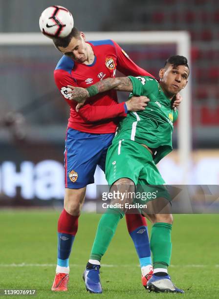 Viktor Vasin of PFC CSKA Moscow and Andres Ponce of FC Anji Makhachkala vie for the ball during the Russian Football League match between PFC CSKA...