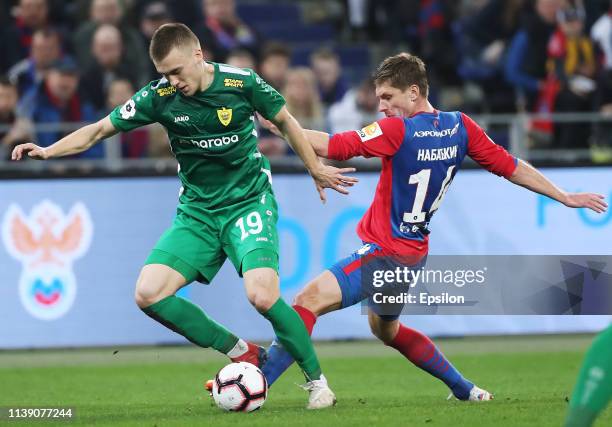 Kirill Nababkin of PFC CSKA Moscow and Pavel Dolgov of FC Anji Makhachkala vie for the ball during the Russian Football League match between PFC CSKA...