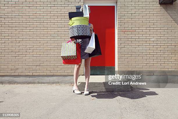 woman with shopping bags and boxes - woman carrying tote bag fotografías e imágenes de stock