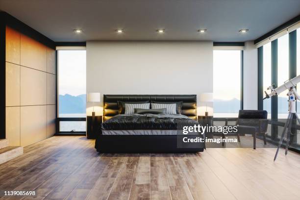 moderne luxe slaapkamer met uitzicht op de oceaan - hotelsuite stockfoto's en -beelden