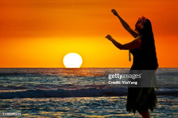 hula dancer on hawaiian beach at sunset with copy space - hawaiian print dress stock pictures, royalty-free photos & images