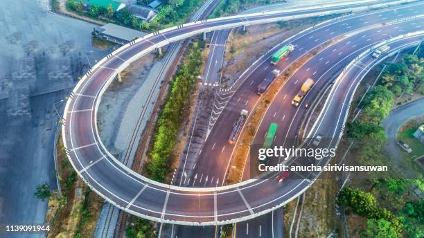 aerial view, expressway road intersection, traffic in bangkok at day, thailand. - crossroad top view stockfoto's en -beelden