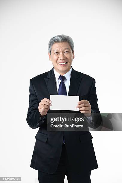 old business man with a panel - holding card stock pictures, royalty-free photos & images