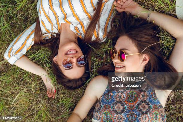 hippie-tagtraum - lying on grass stock-fotos und bilder