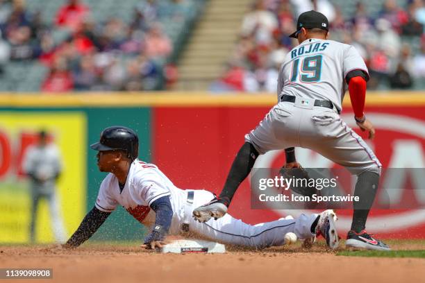 Cleveland Indians third baseman Jose Ramirez stems second base as the throw gets away from Miami Marlins infielder Miguel Rojas during the fourth...