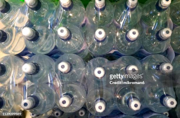bottles of mineral water - water cooler stockfoto's en -beelden