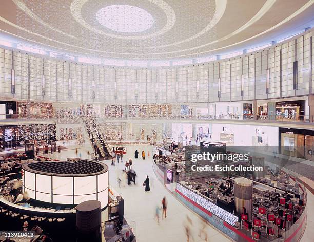 people shopping at the dubai mall, uae. - dubai mall stock pictures, royalty-free photos & images